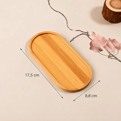 Tabuleiro de madeira oval com bordos elevados, acabamento natural e medidas de 17,5 × 8,8 cm.